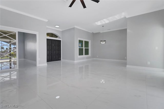 spare room featuring crown molding and ceiling fan