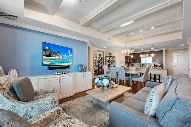 living room with crown molding, a tray ceiling, dark hardwood / wood-style flooring, a notable chandelier, and beamed ceiling