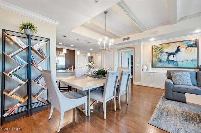 dining space featuring an inviting chandelier, hardwood / wood-style flooring, crown molding, and beamed ceiling