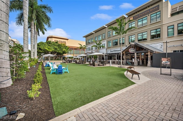 surrounding community with a gazebo and a lawn