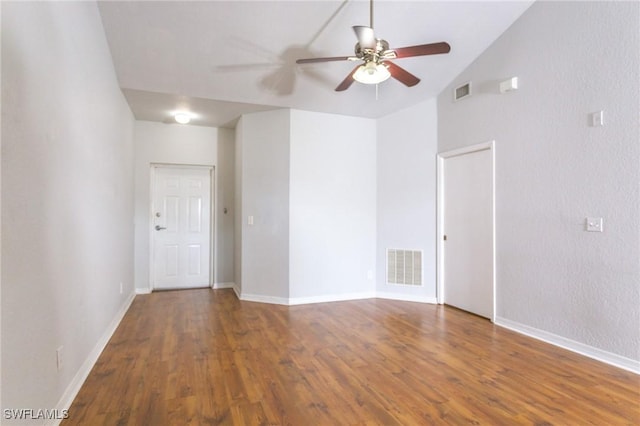 unfurnished room with hardwood / wood-style floors, high vaulted ceiling, and ceiling fan