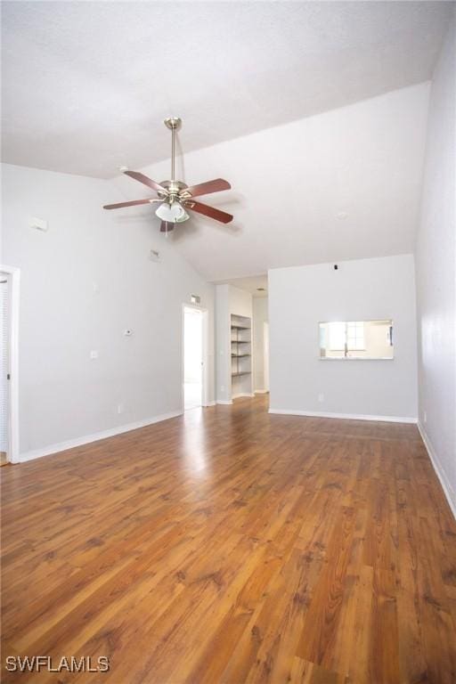 unfurnished living room with ceiling fan, wood-type flooring, and vaulted ceiling