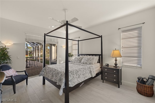 bedroom featuring access to exterior, ceiling fan, and hardwood / wood-style floors