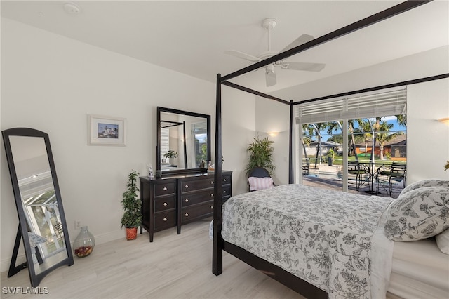 bedroom featuring access to exterior, ceiling fan, and wood-type flooring