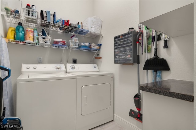 laundry room with separate washer and dryer