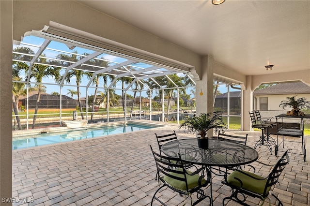 view of pool with a lanai and a patio area