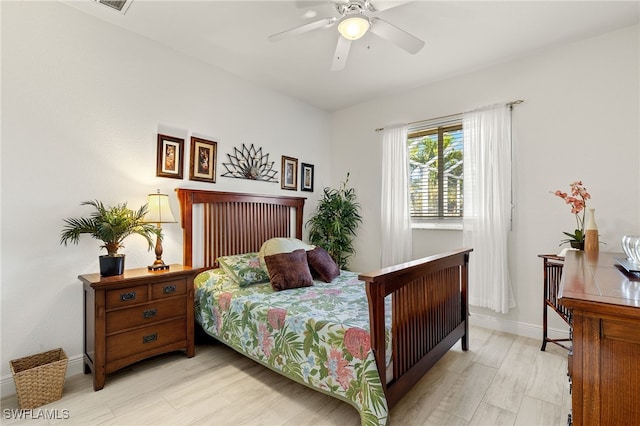 bedroom featuring ceiling fan and light hardwood / wood-style floors