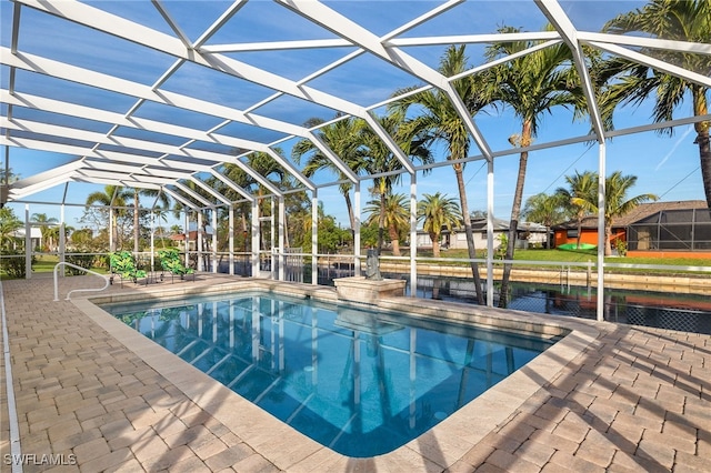 view of swimming pool with a lanai and a patio