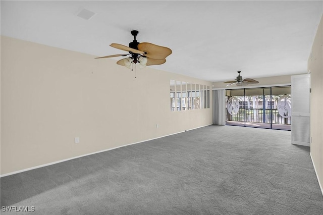 unfurnished room with ceiling fan, carpet floors, and baseboards