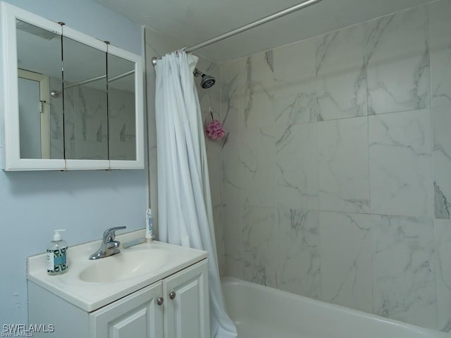 bathroom featuring vanity and shower / tub combo with curtain