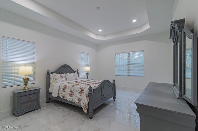 bedroom with a tray ceiling