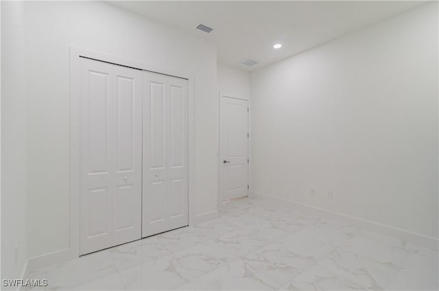 unfurnished bedroom with a closet