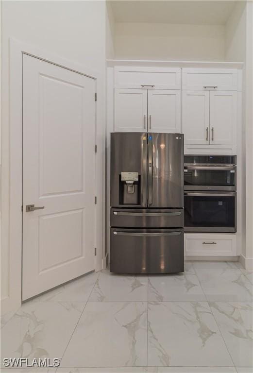 kitchen with white cabinetry and appliances with stainless steel finishes