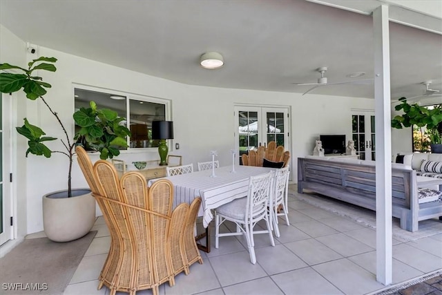 view of patio with an outdoor hangout area, ceiling fan, outdoor dining area, and french doors