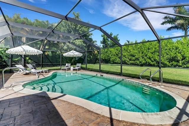 outdoor pool with a lawn, a lanai, and a patio area