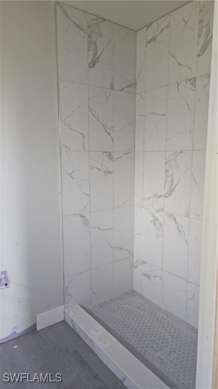 2618 25th St W, Lehigh Acres, FL 33971 - bathroom featuring tiled shower