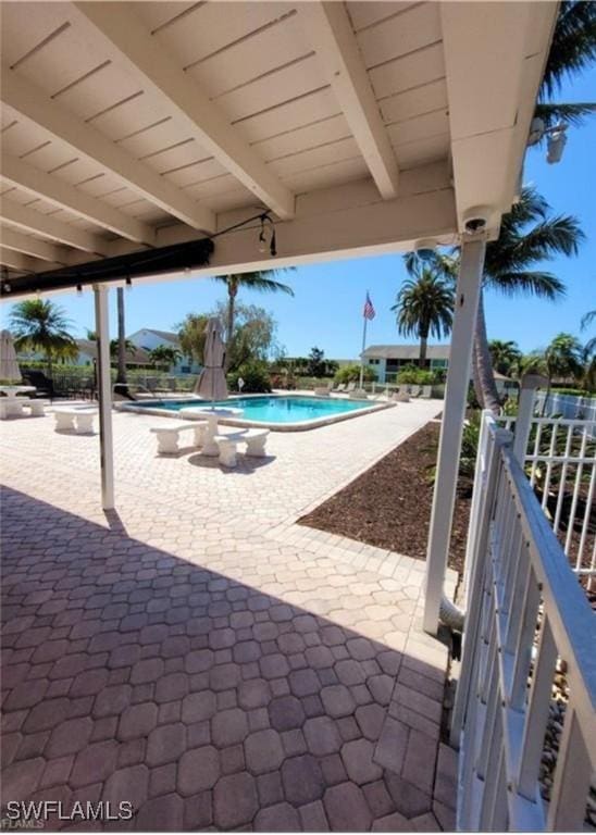 view of patio / terrace featuring a community pool