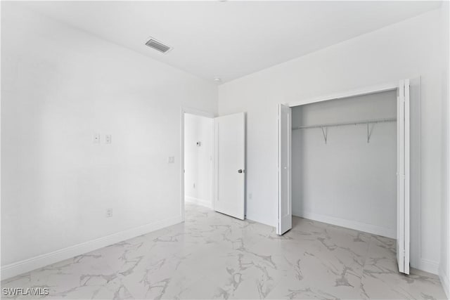 unfurnished bedroom featuring a closet