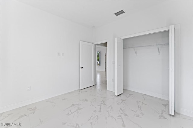 unfurnished bedroom featuring a closet