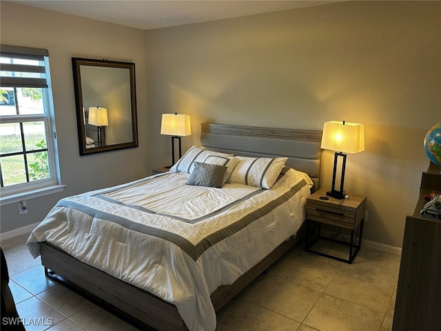 bedroom with light tile patterned floors