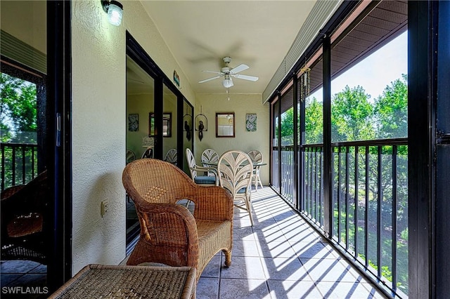 sunroom / solarium with ceiling fan