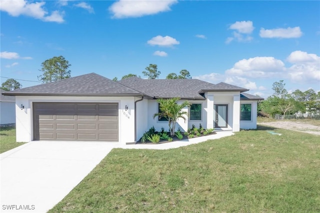 view of front of property featuring a garage and a front yard