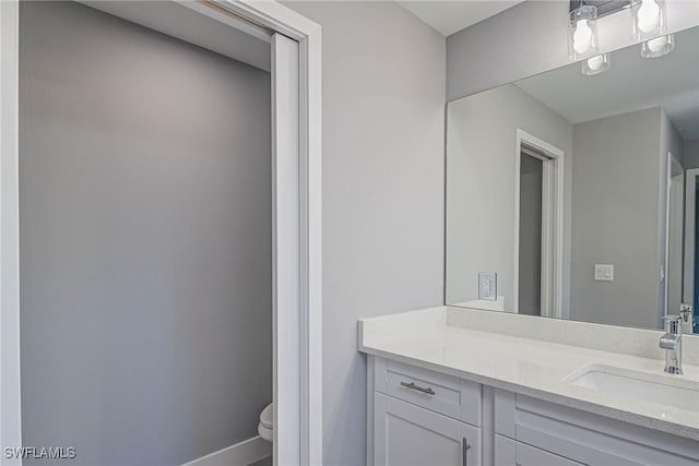 bathroom with vanity and toilet