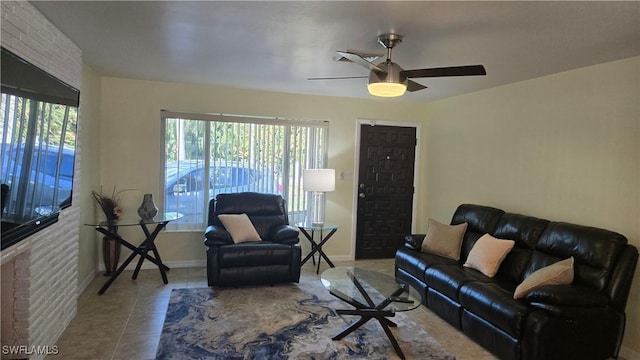 tiled living room with ceiling fan