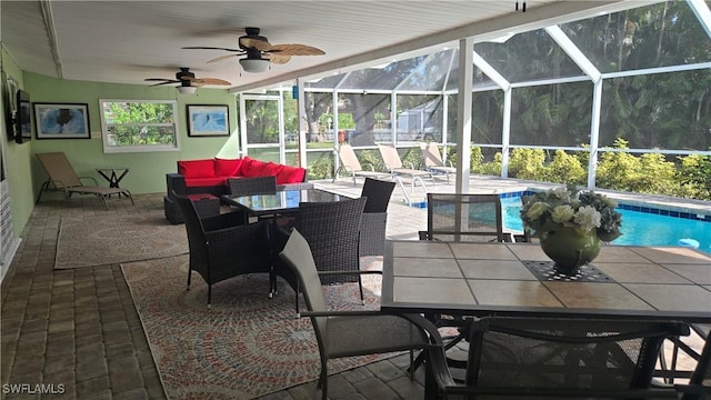 view of patio featuring a lanai