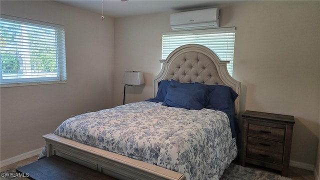 bedroom with a wall unit AC