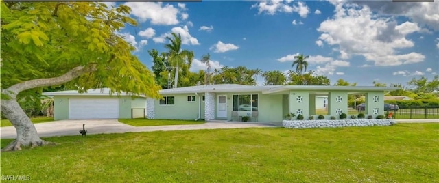 single story home with a garage and a front lawn