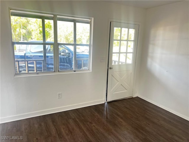 doorway featuring dark hardwood / wood-style floors