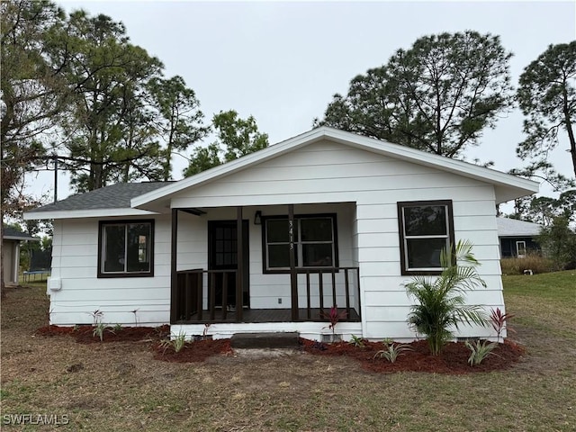 view of front of house featuring a front yard and a porch