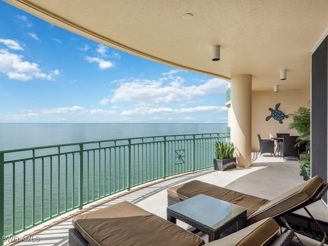 balcony featuring a water view