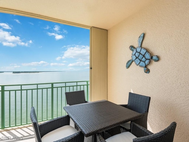 balcony featuring a water view