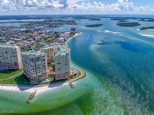 bird's eye view with a water view and a view of the beach