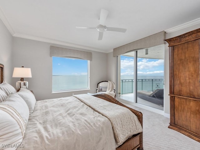 carpeted bedroom featuring access to exterior, ceiling fan, a water view, and multiple windows