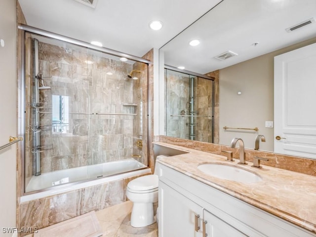 full bathroom with tile patterned flooring, vanity, toilet, and enclosed tub / shower combo