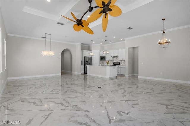 unfurnished living room with crown molding and ceiling fan with notable chandelier