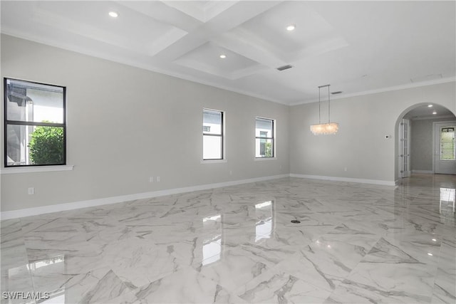 empty room featuring ornamental molding, coffered ceiling, and beam ceiling