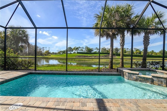 view of pool with a lanai, a water view, and an in ground hot tub