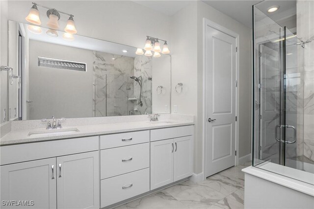 bathroom featuring an enclosed shower and vanity