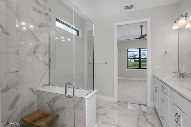 bathroom with vanity, ceiling fan, and a shower with shower door