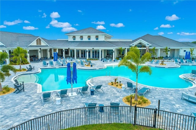 view of swimming pool with a patio area