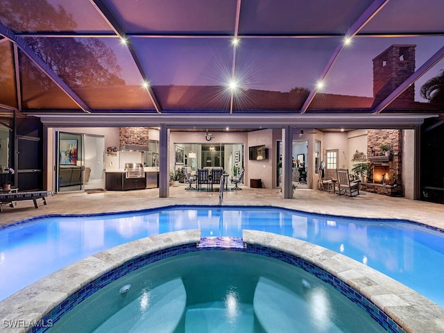 view of pool featuring a patio area and an in ground hot tub