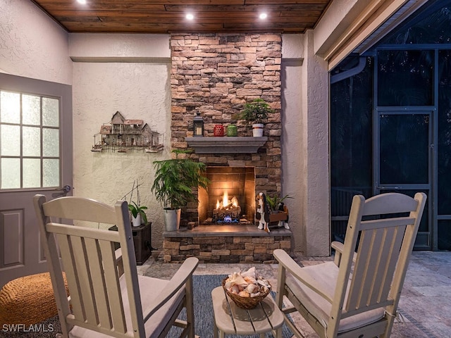 view of patio with an outdoor stone fireplace