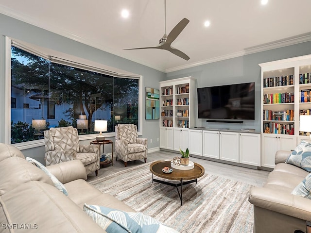 living room with ceiling fan, crown molding, and light hardwood / wood-style flooring