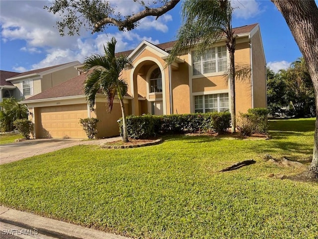 view of front of home with a garage and a front lawn