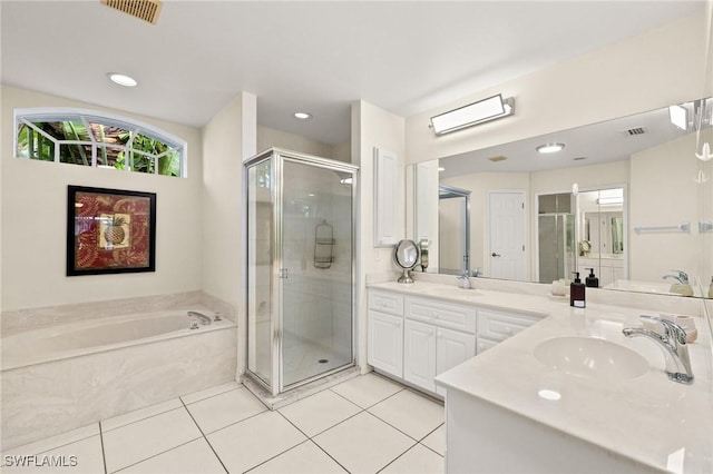 bathroom featuring vanity, tile patterned flooring, and shower with separate bathtub