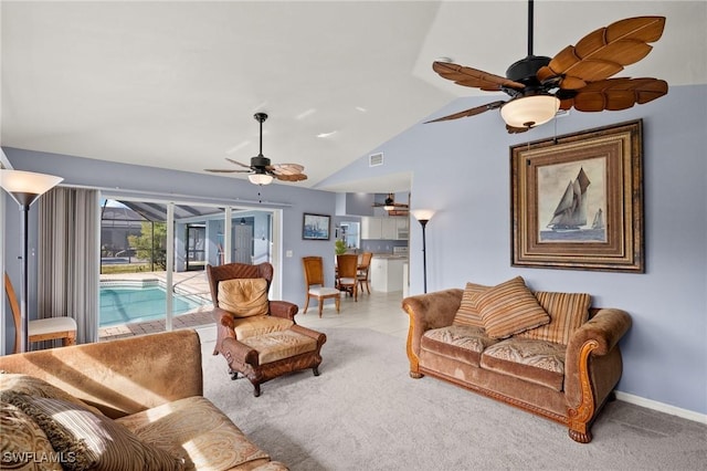 living room with ceiling fan, carpet flooring, and lofted ceiling